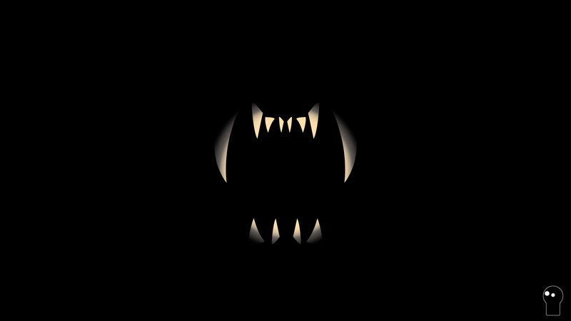 glowing fangs in darkness