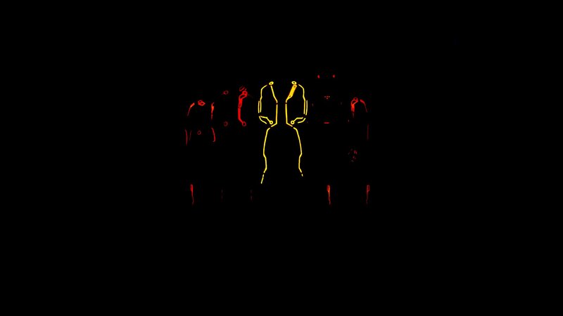 glowing figures in darkness