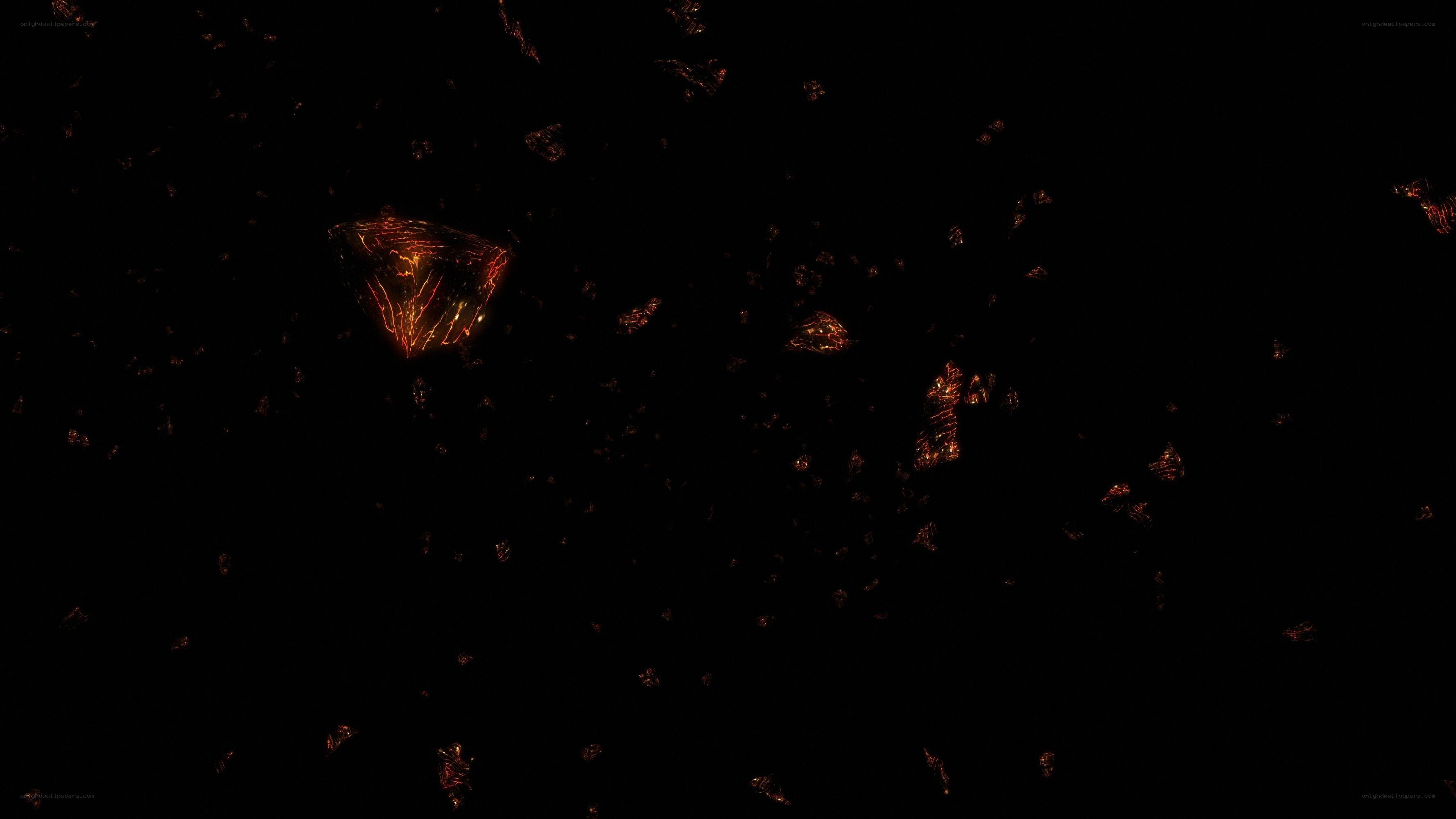 glowing fragments in darkness