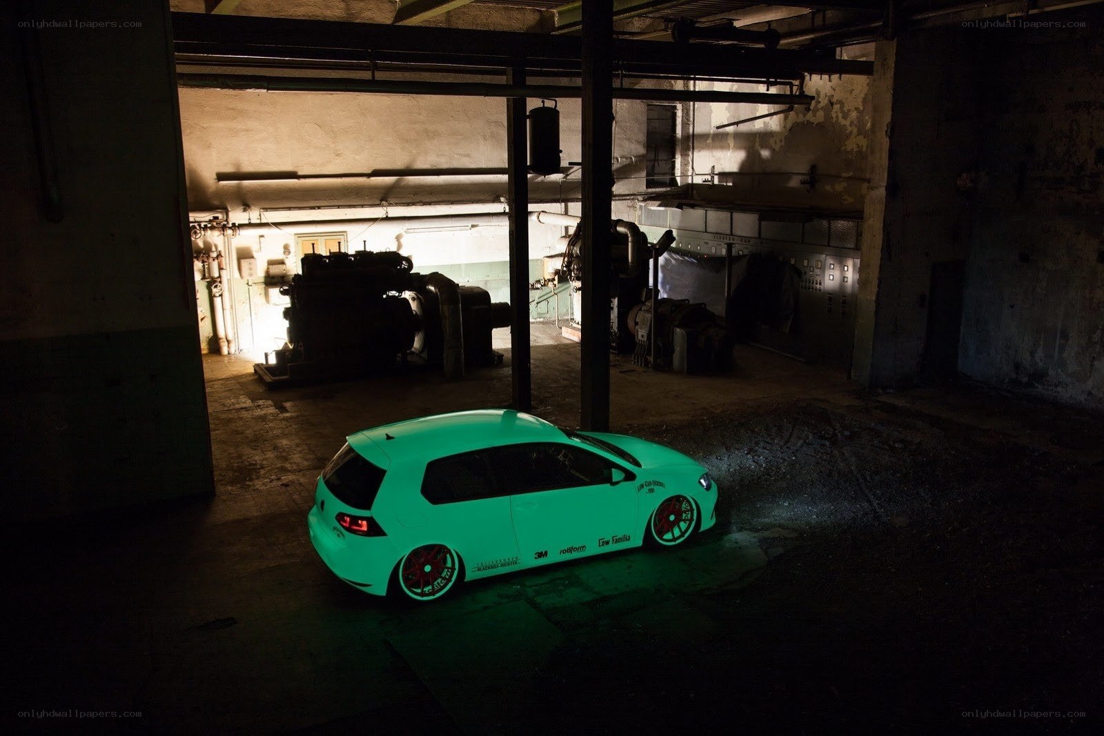 glowing green car in basement