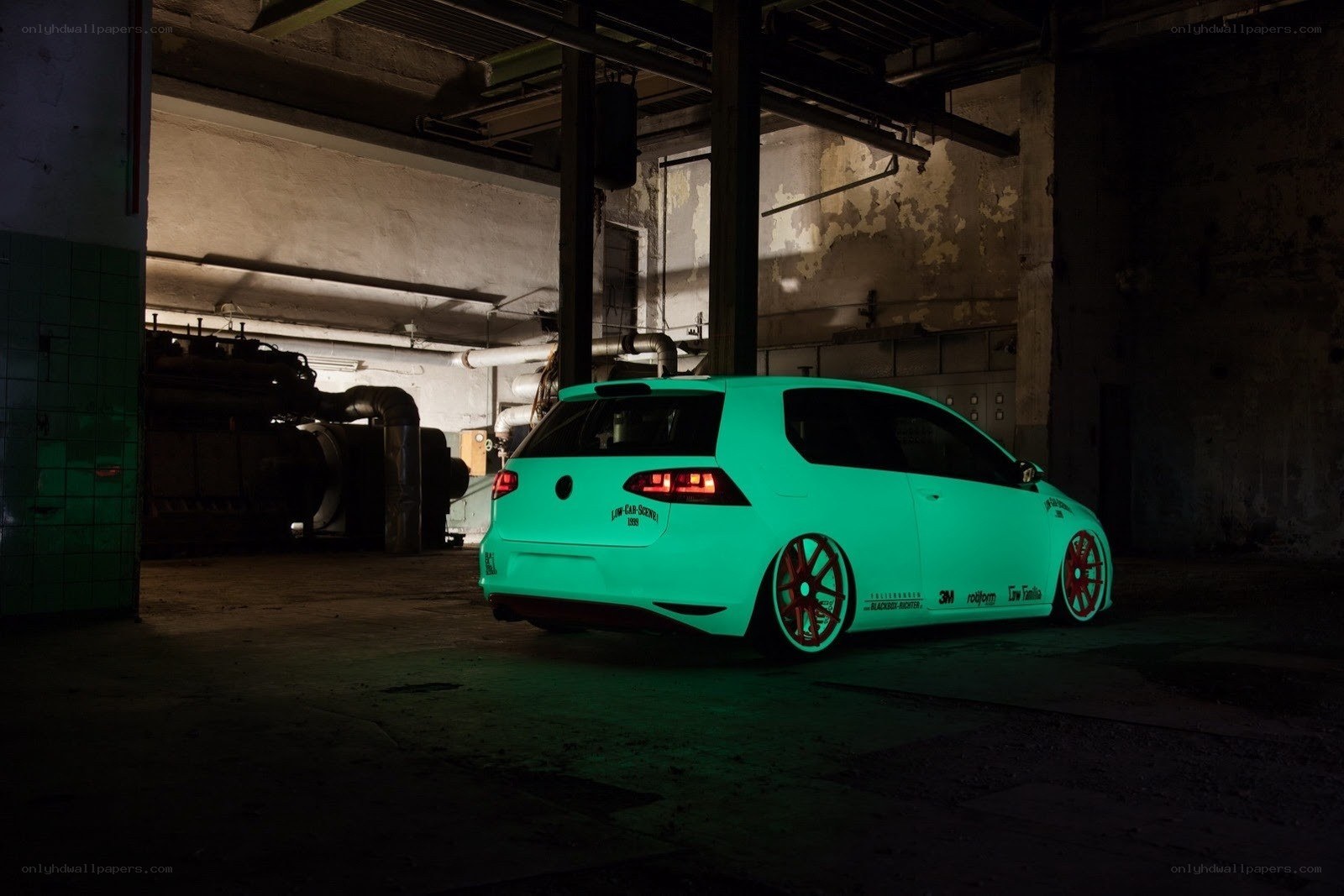 glowing green car in warehouse