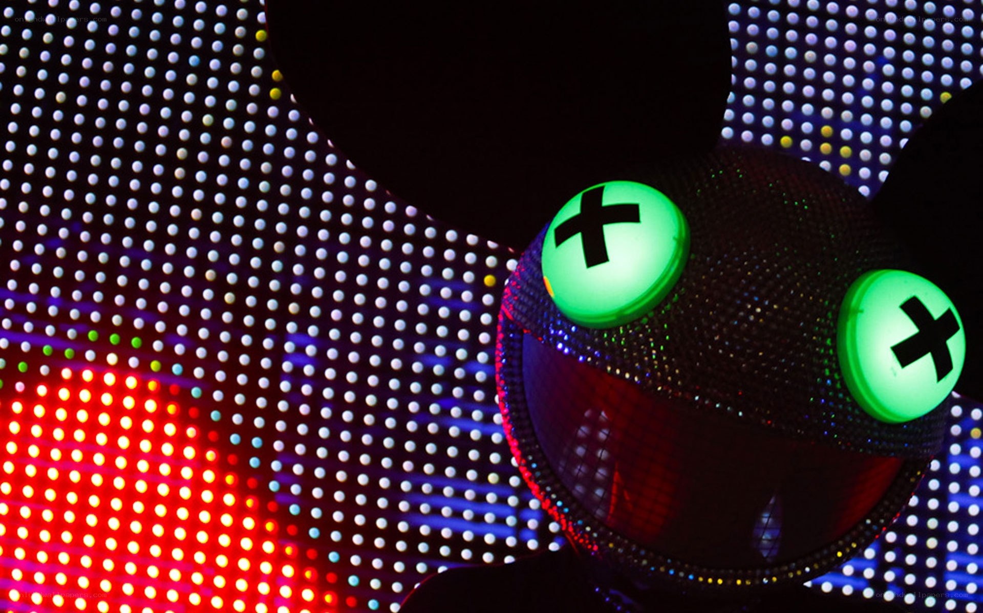 glowing green eyes on a mask