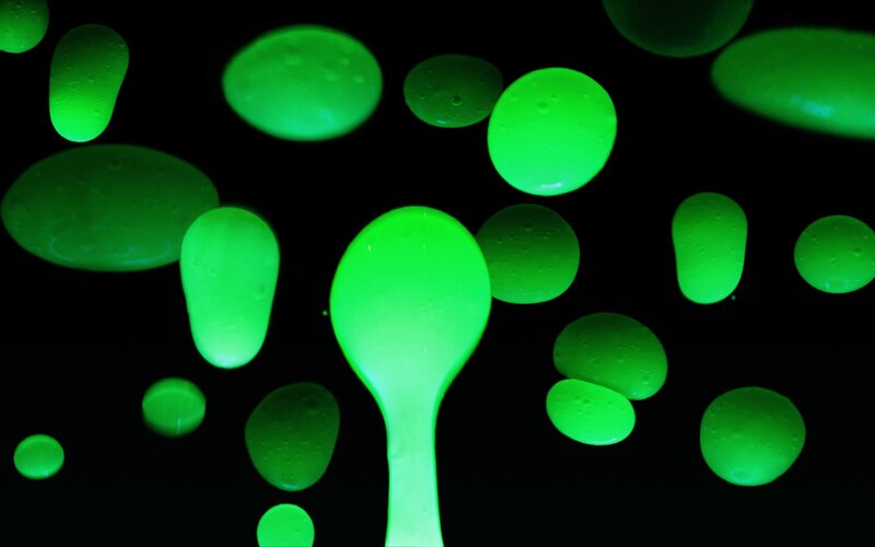 Glowing Green Liquid Droplets — Mysterious