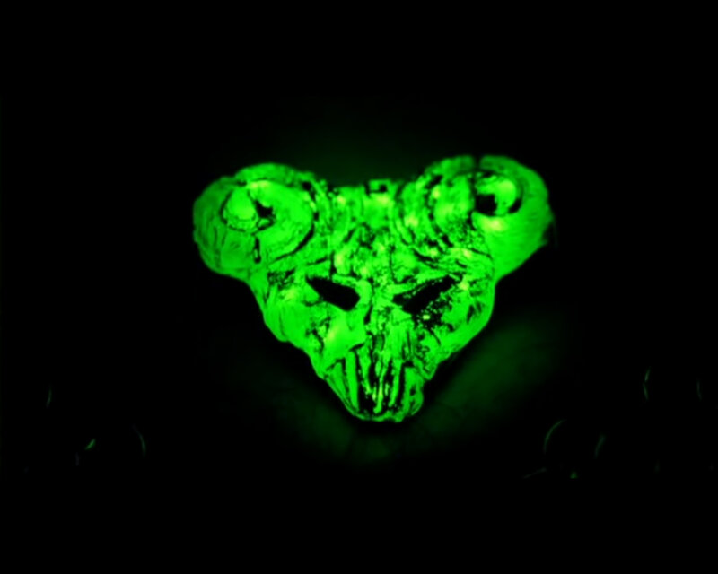 glowing green skull pendant