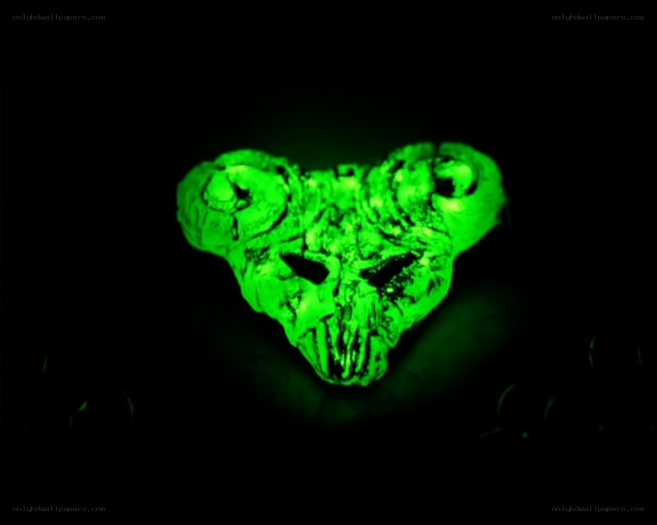 glowing green skull pendant
