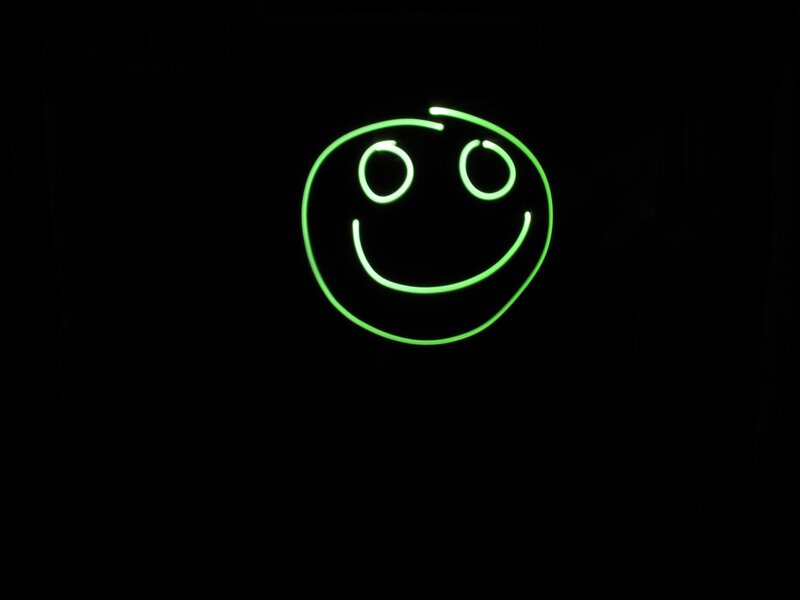Glowing Green Smiley Face — Calm