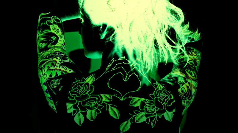glowing green tattoo art