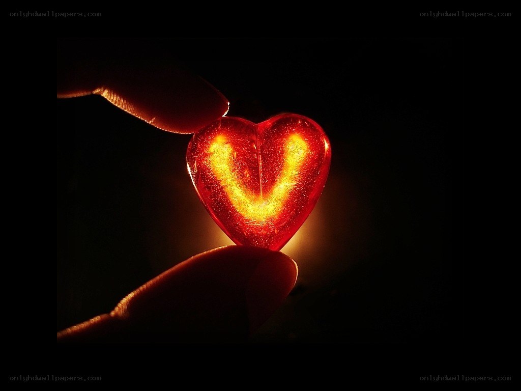 glowing heart in hand