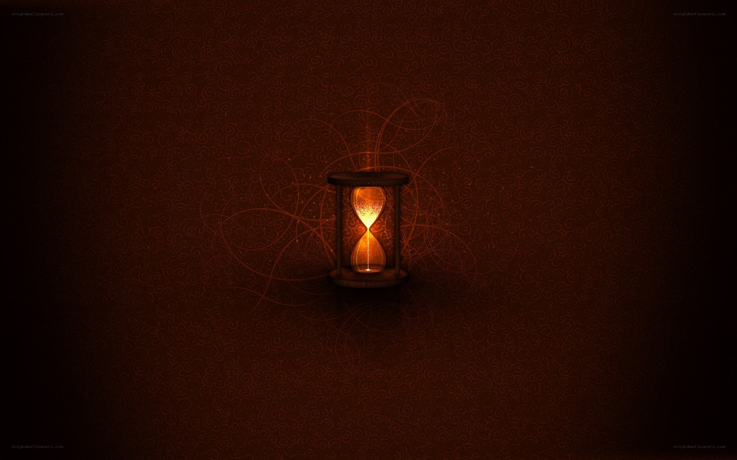 glowing hourglass in darkness