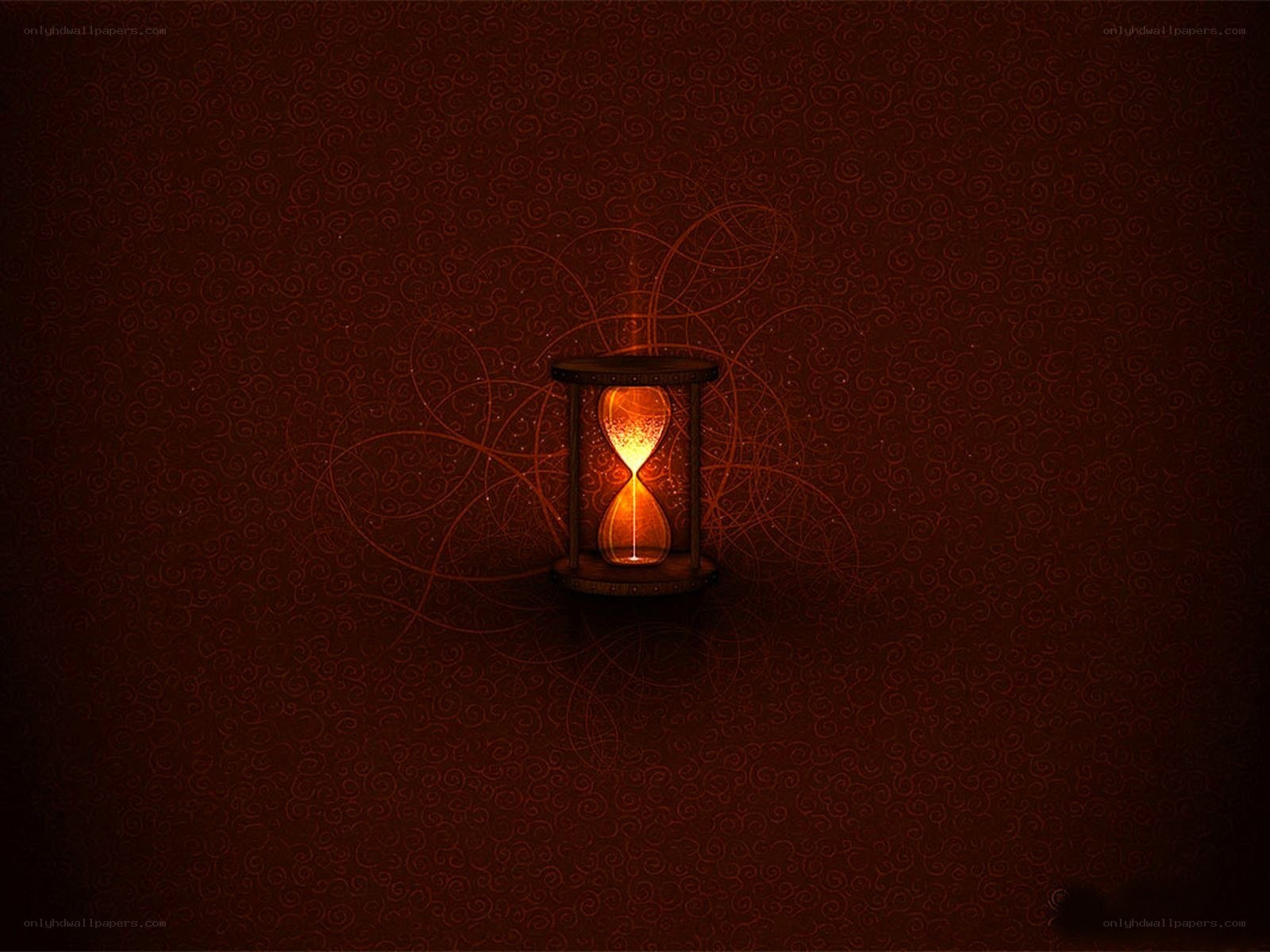 glowing hourglass on dark background