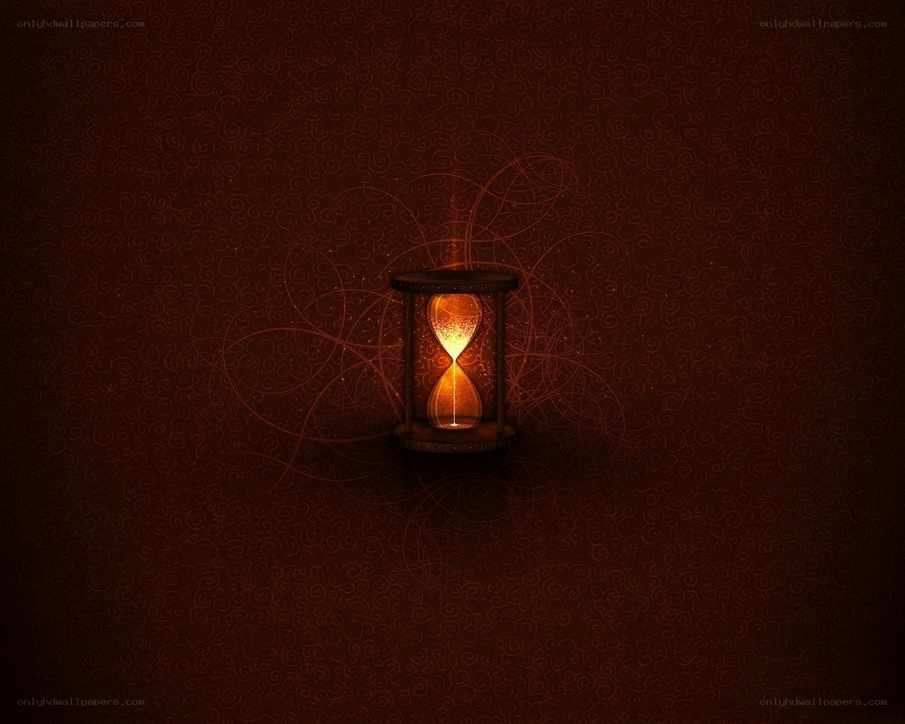 glowing hourglass on dark background