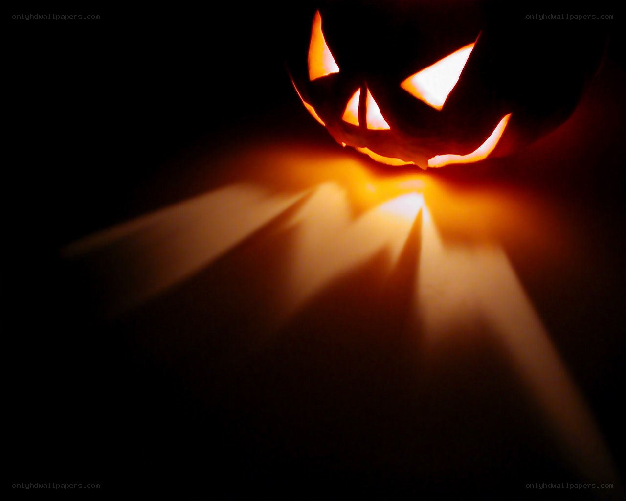 glowing jack-o-lantern in darkness