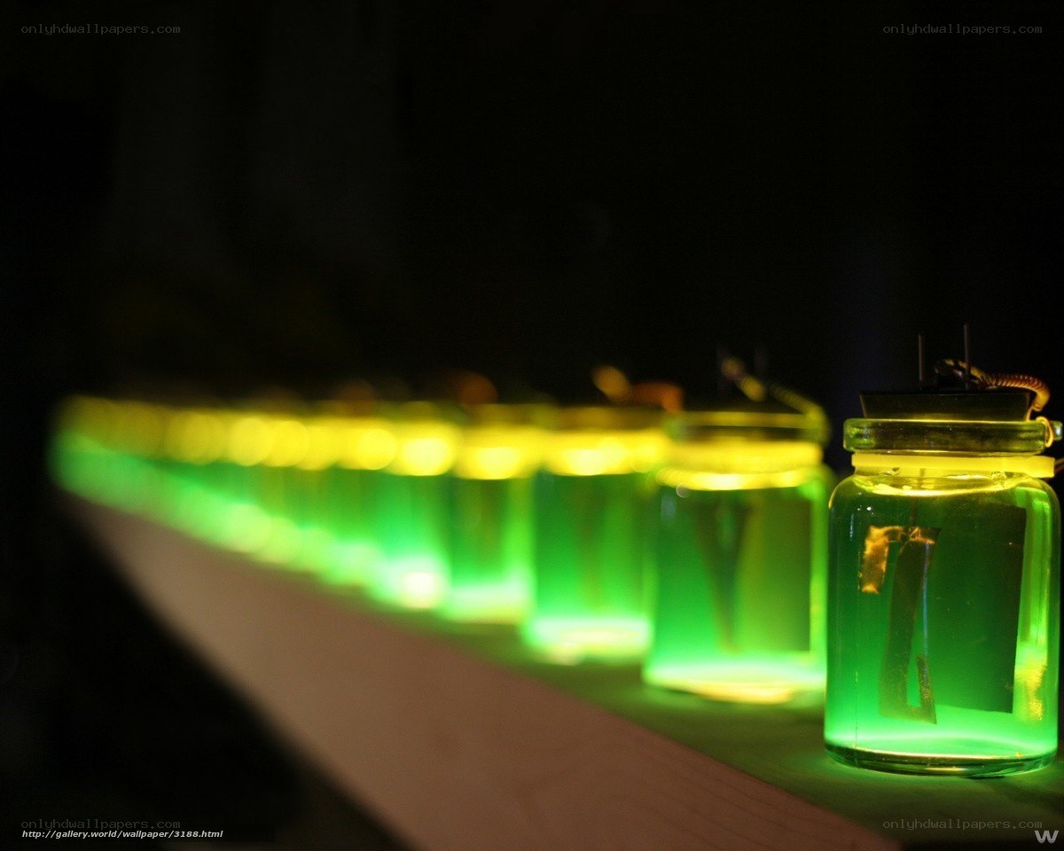 Glowing jars in a dark room