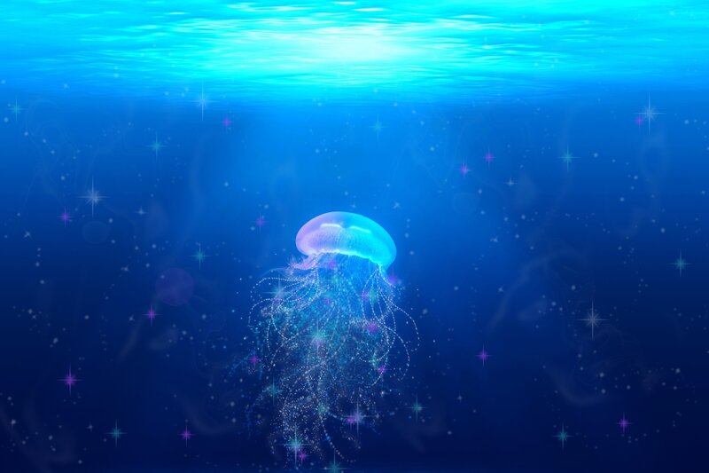 glowing jellyfish in deep sea