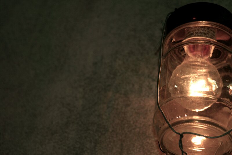 glowing lantern on dark surface