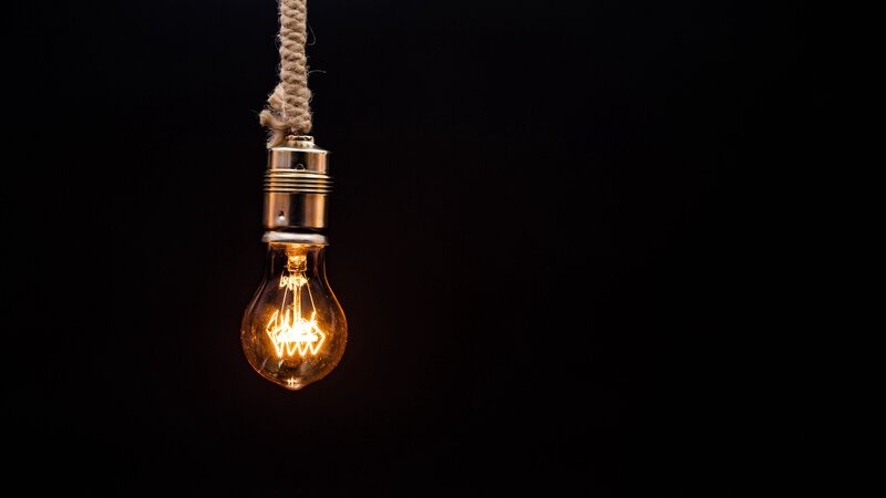 Glowing Light Bulb — Black, Dramatic, Photograph, Rope