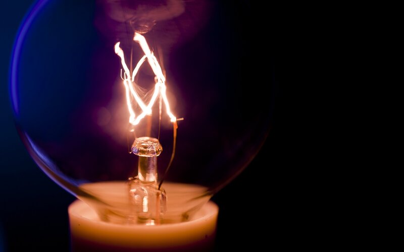 Glowing Light Bulb Filament — Black