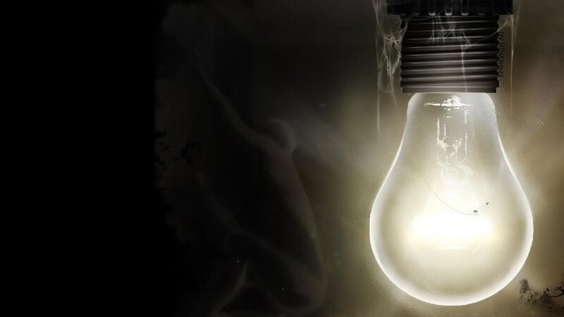 glowing light bulb in dark