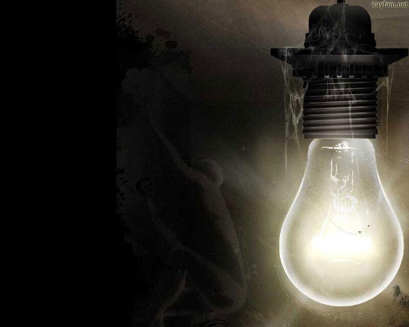 glowing light bulb in dark room