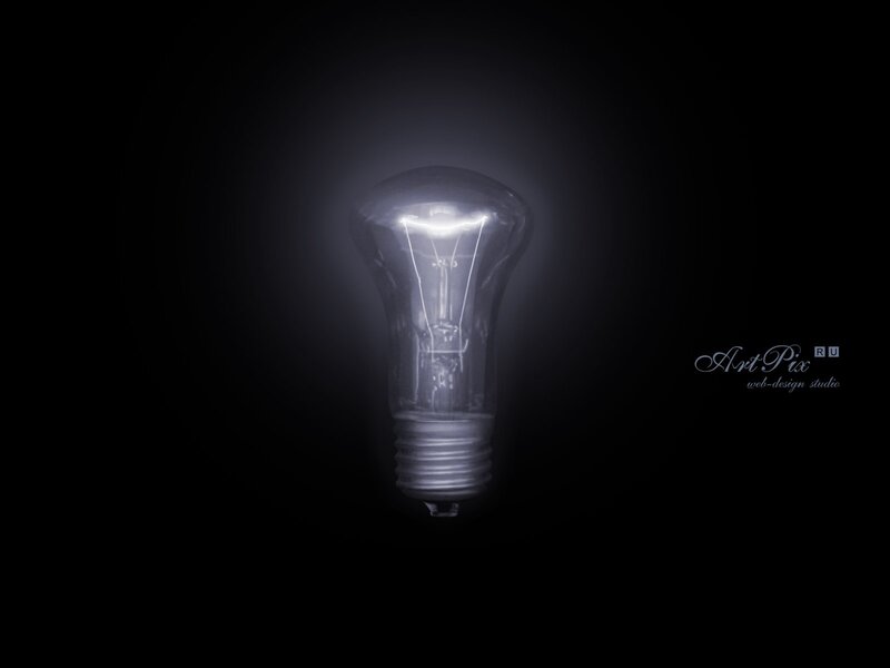 glowing light bulb in darkness