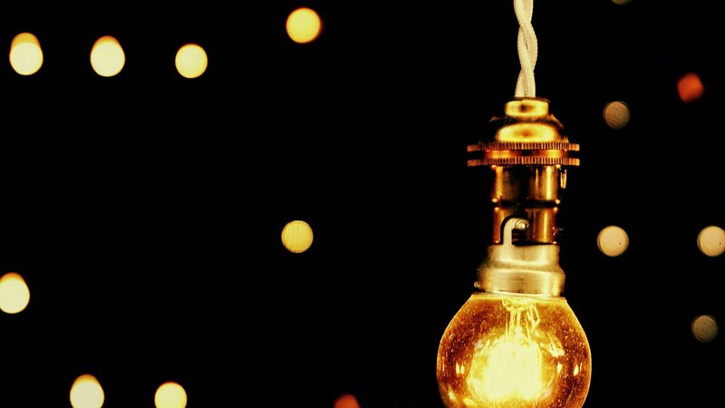 glowing light bulb with bokeh