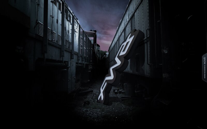 Glowing Logo Between Trains