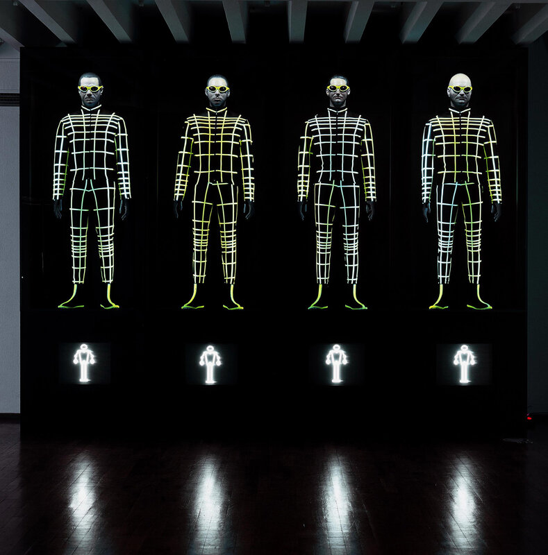 glowing mannequins in grid suits