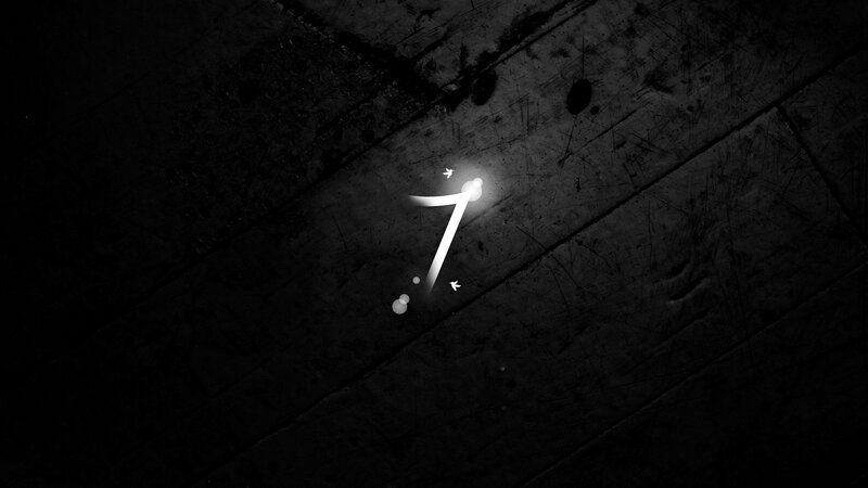 glowing number seven on wood