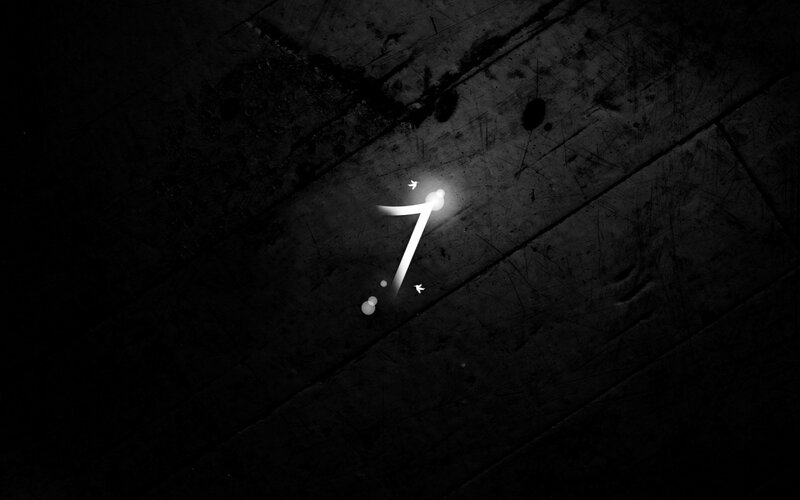 glowing number seven on wood