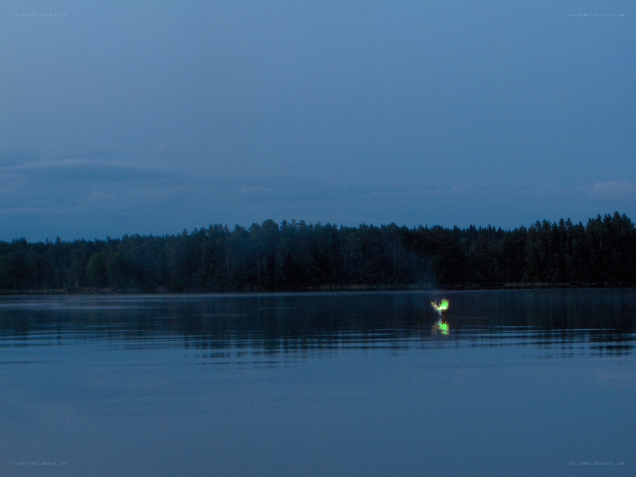 glowing object on lake at dusk