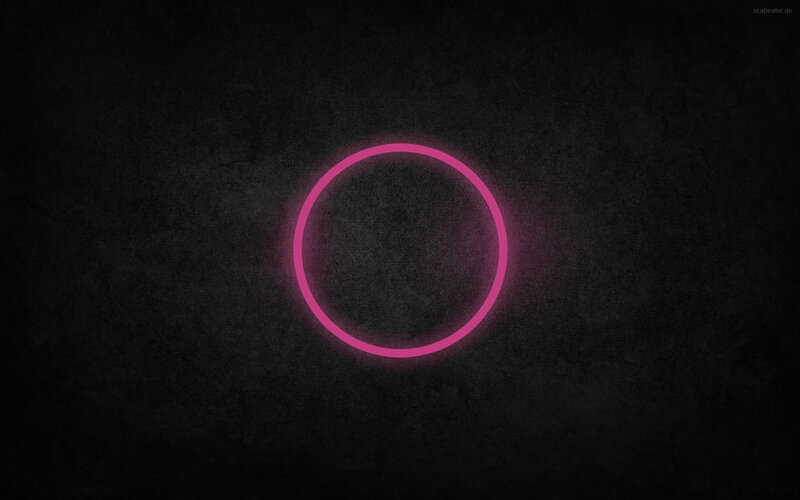 glowing pink circle on dark background
