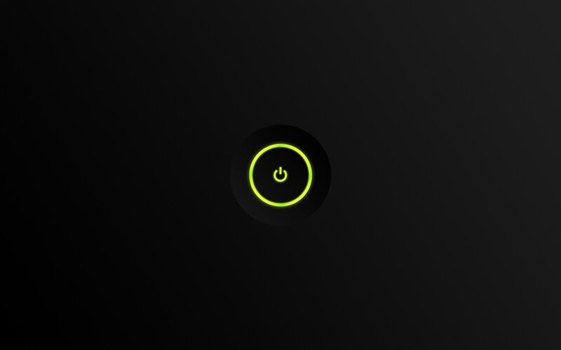 glowing power button on black