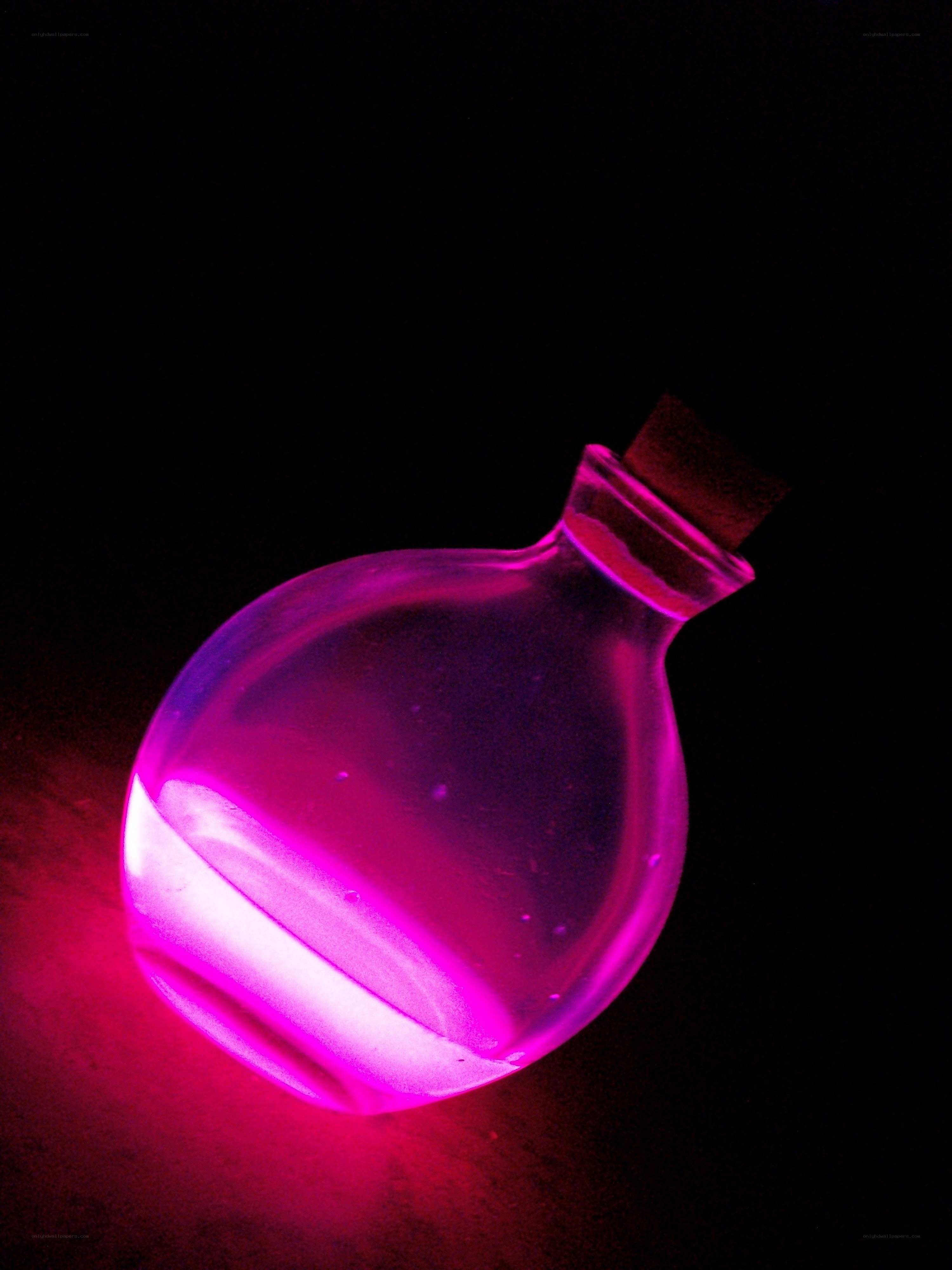 glowing purple potion bottle