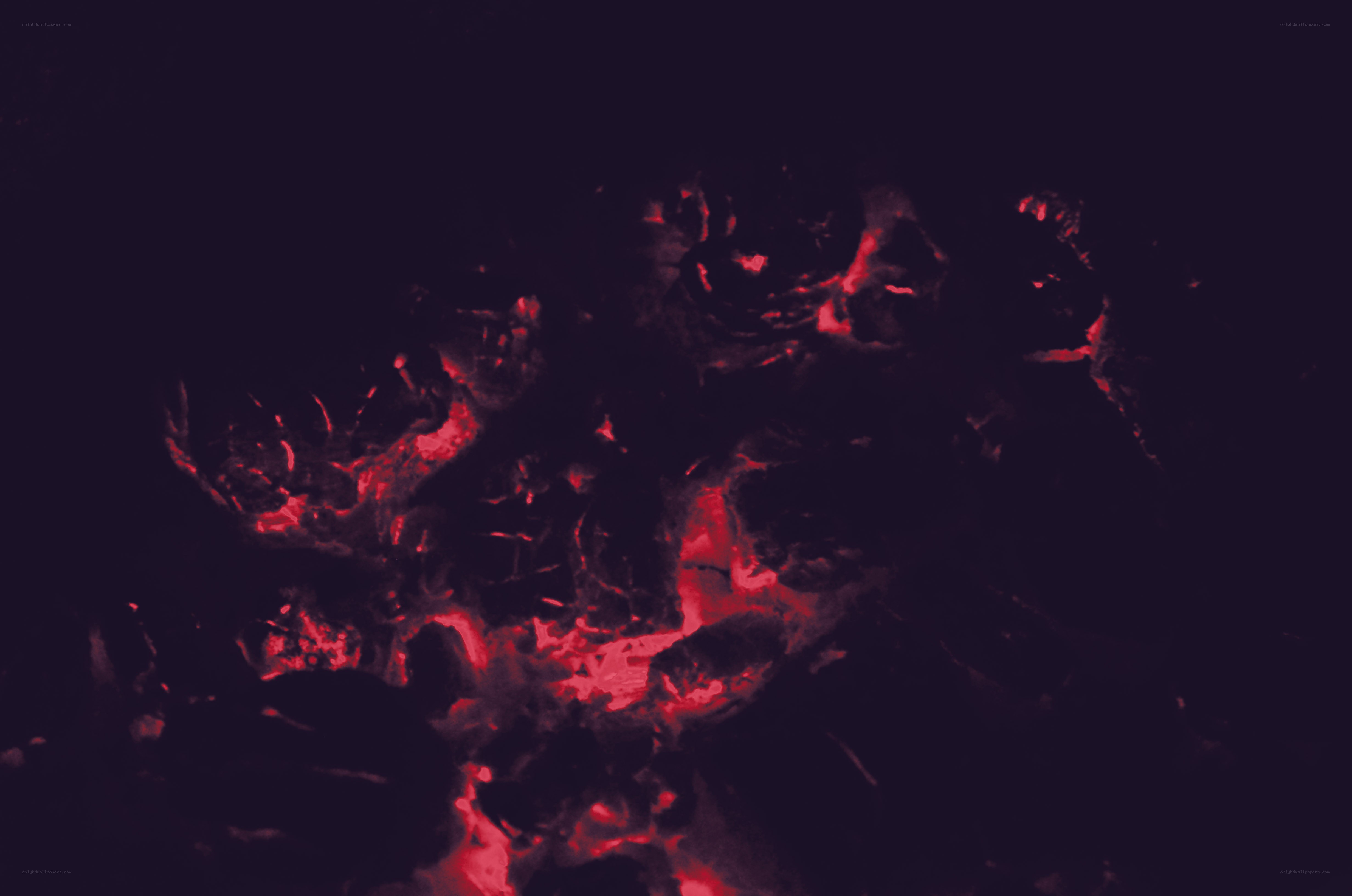 glowing red embers in darkness