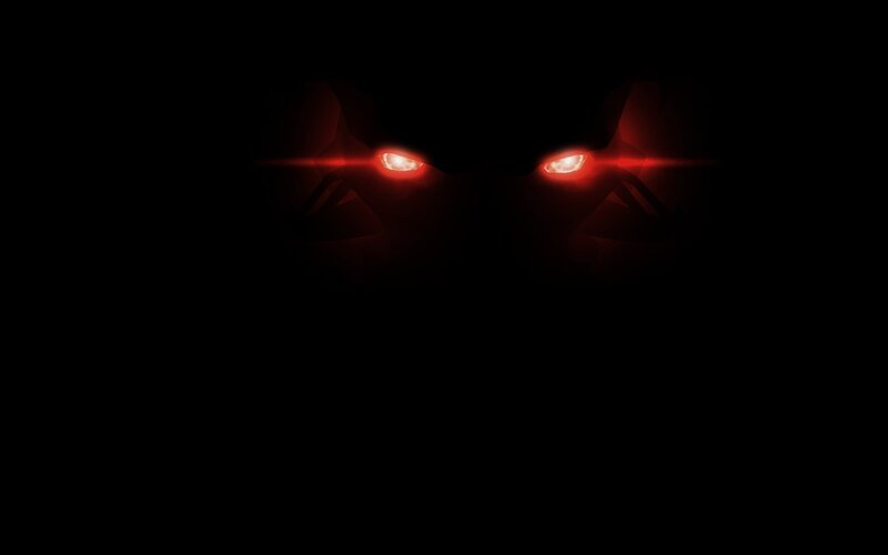 glowing red eyes in darkness