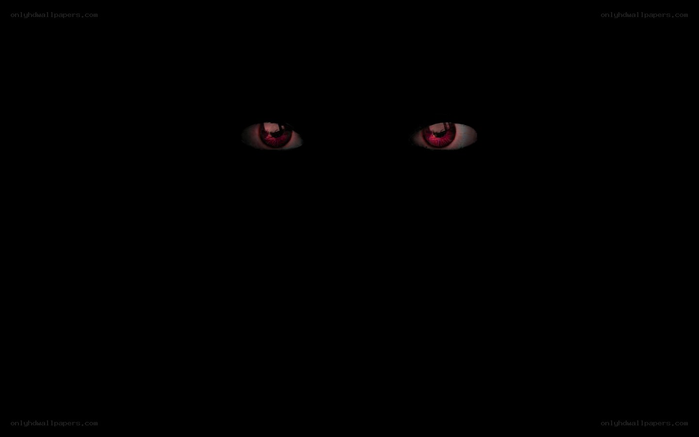 glowing red eyes in darkness