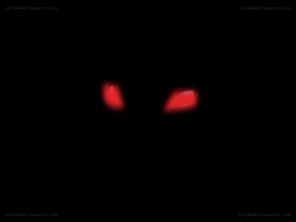 glowing red eyes in darkness