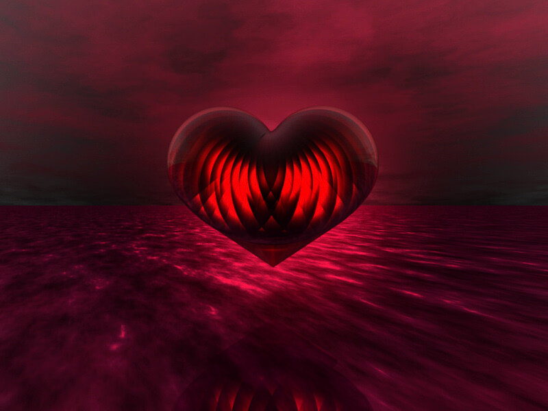 glowing red heart over water