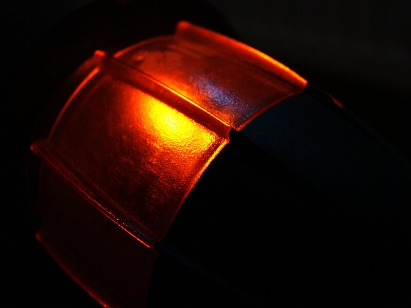 glowing red object in darkness