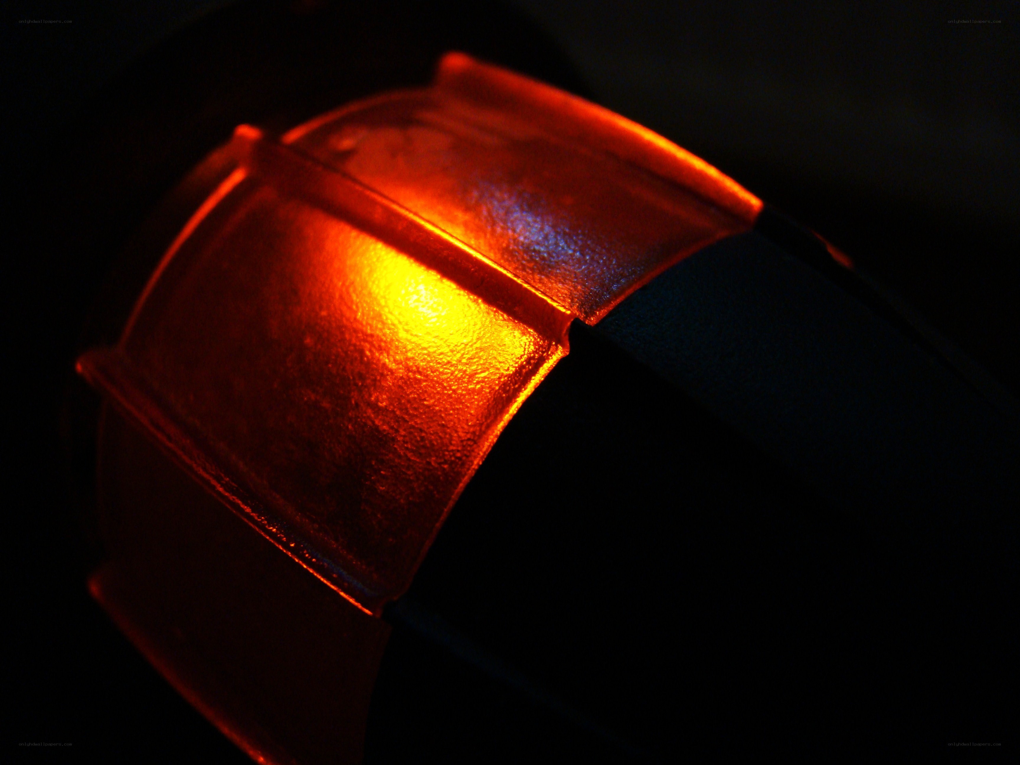glowing red object in darkness