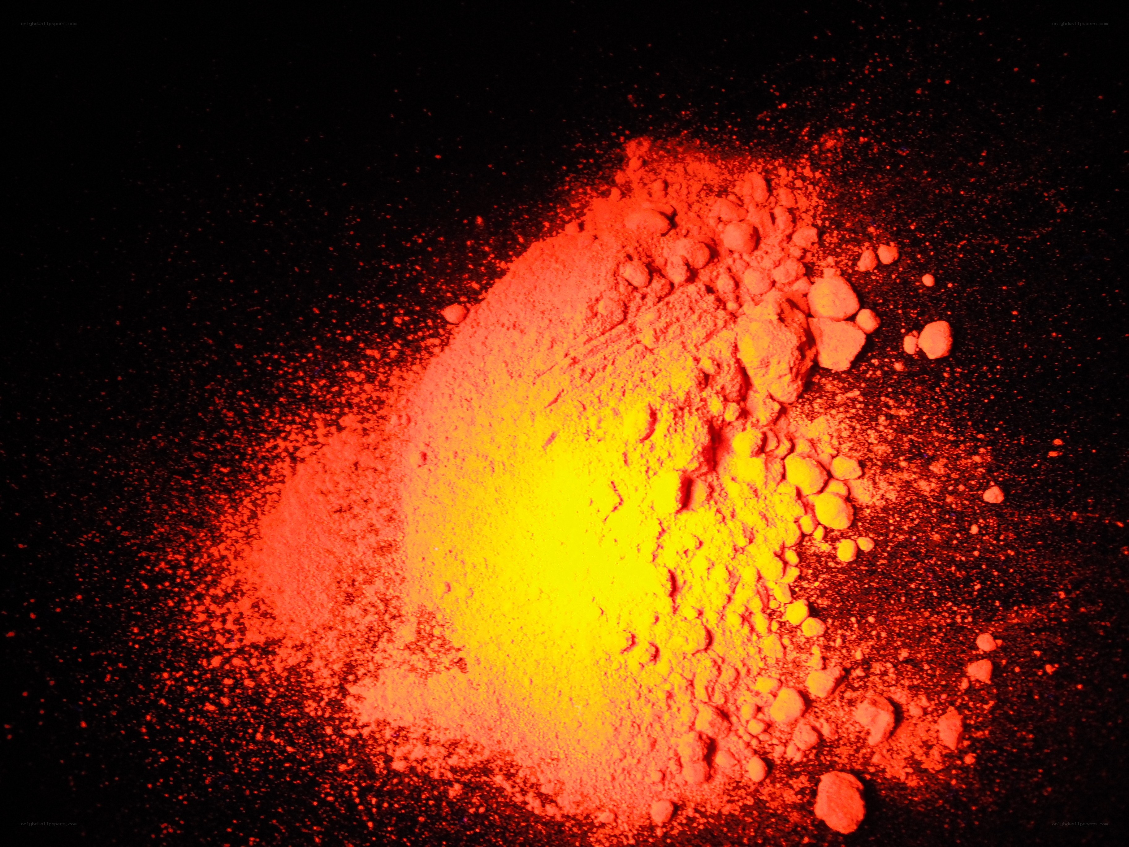 glowing red powder on black