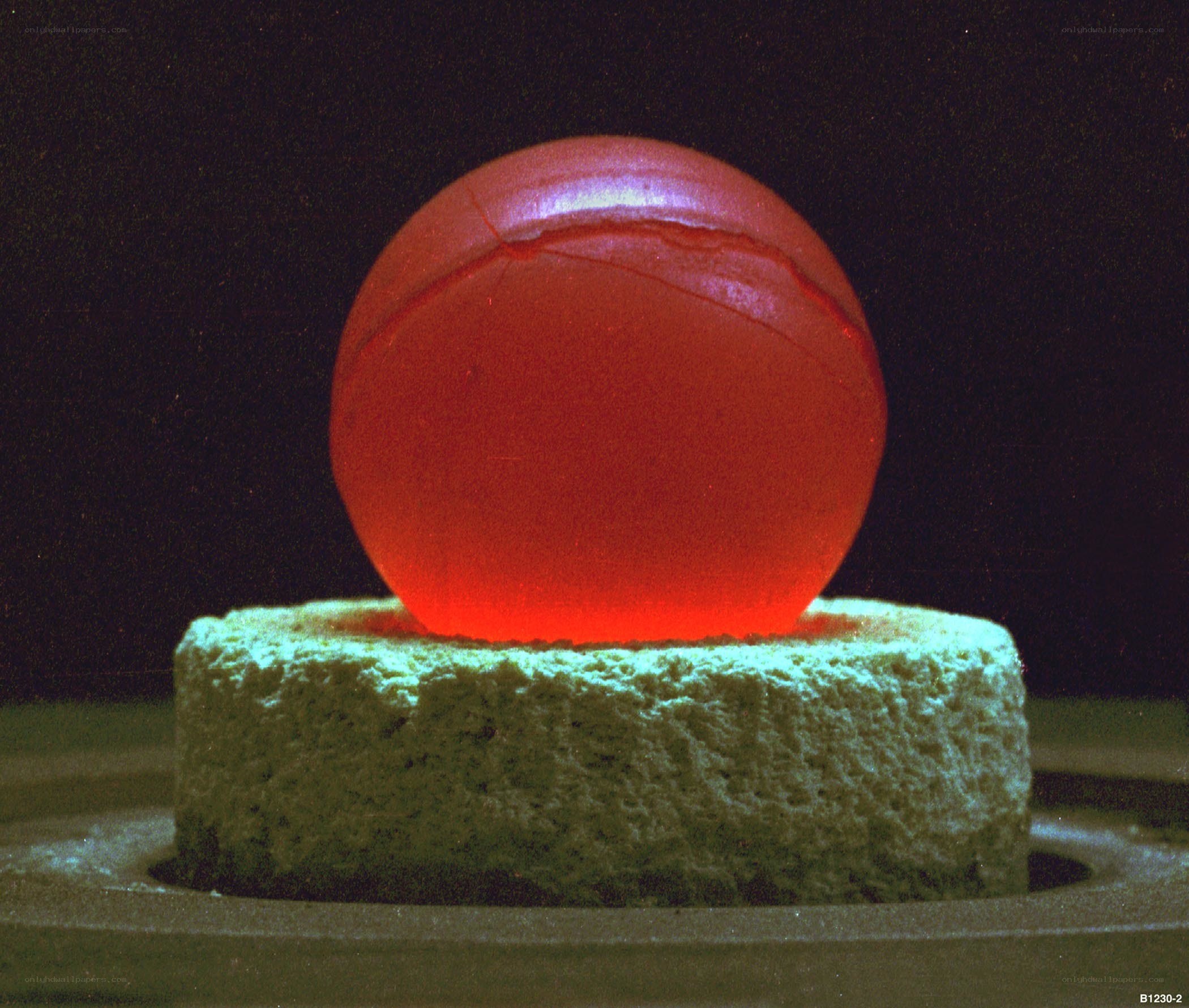 Glowing red sphere on pedestal