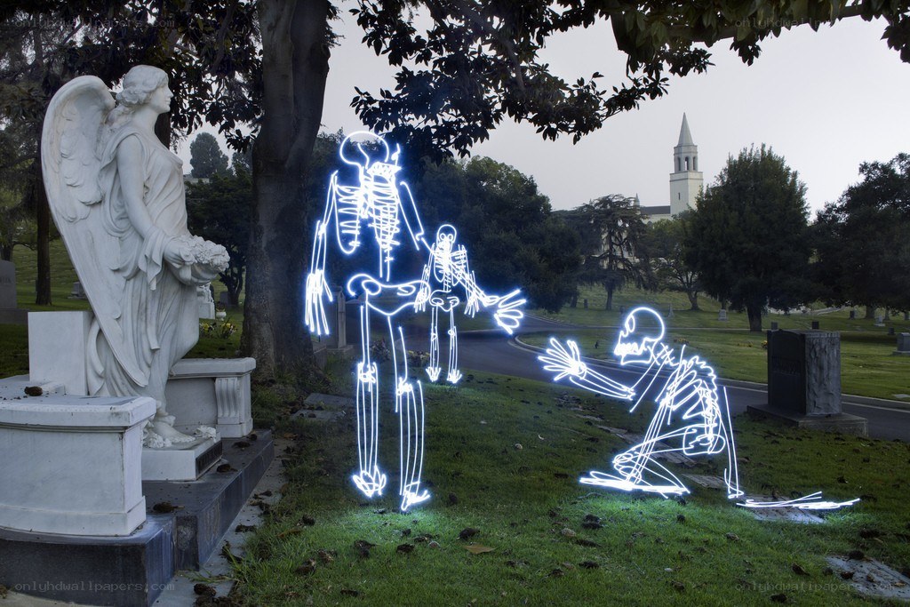 Glowing skeletons in a cemetery