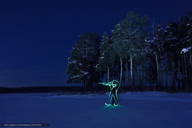 Glowing skier at night