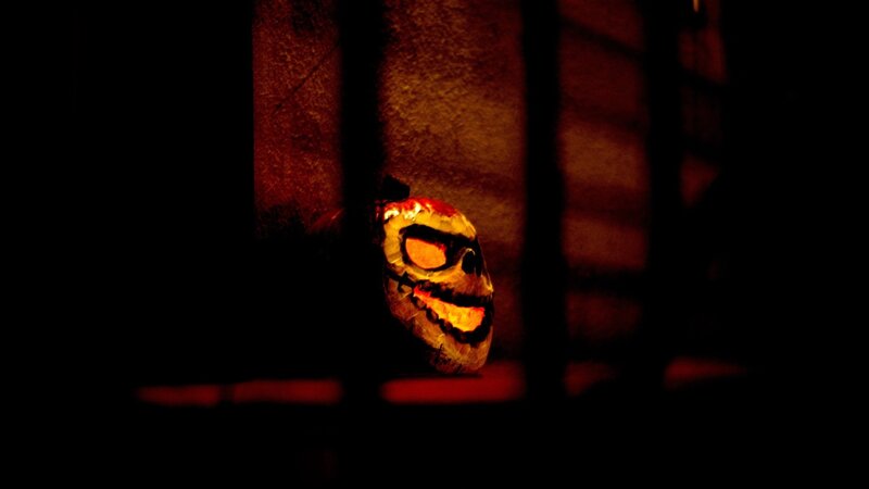 glowing skull behind bars