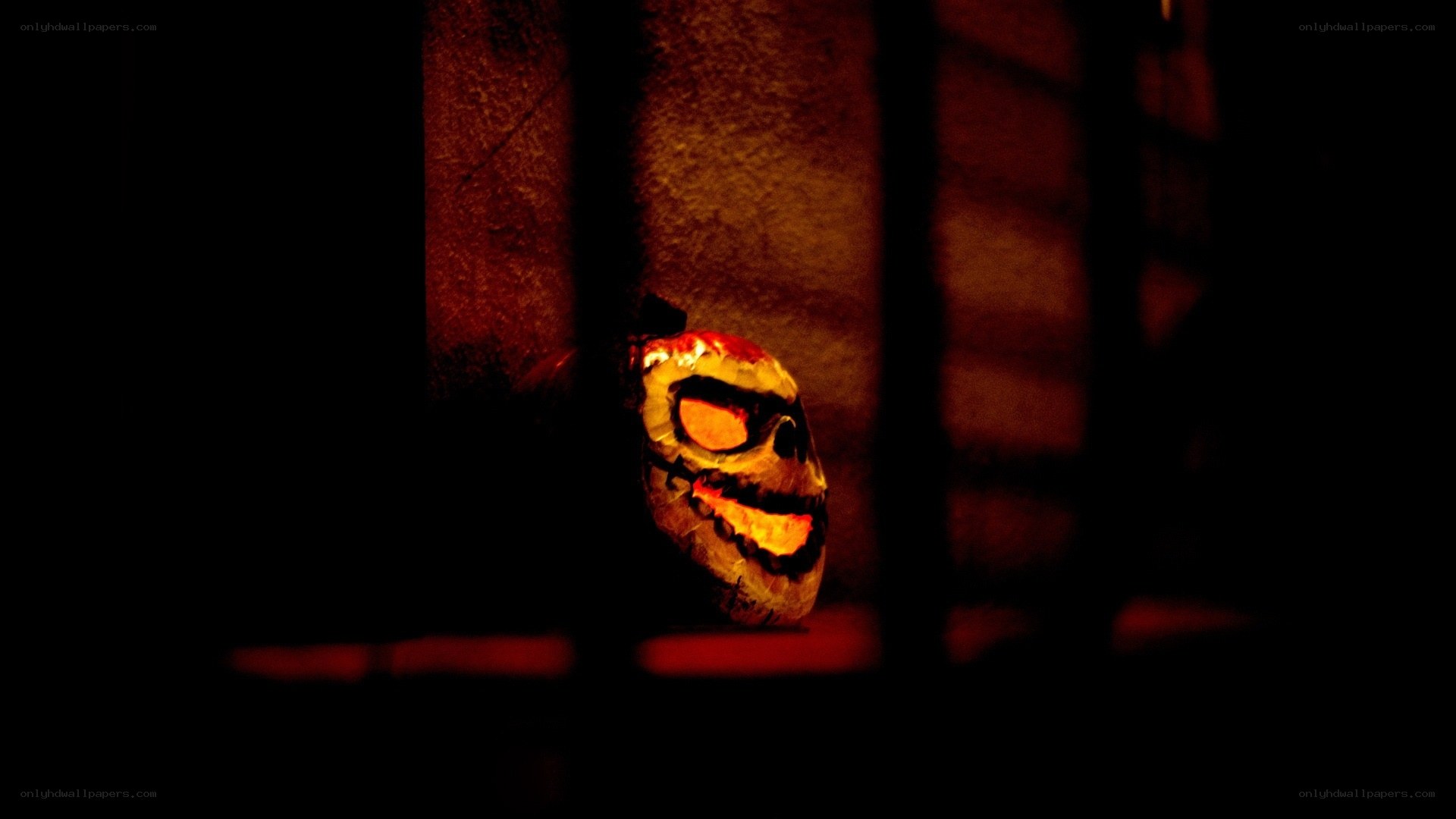 glowing skull behind bars