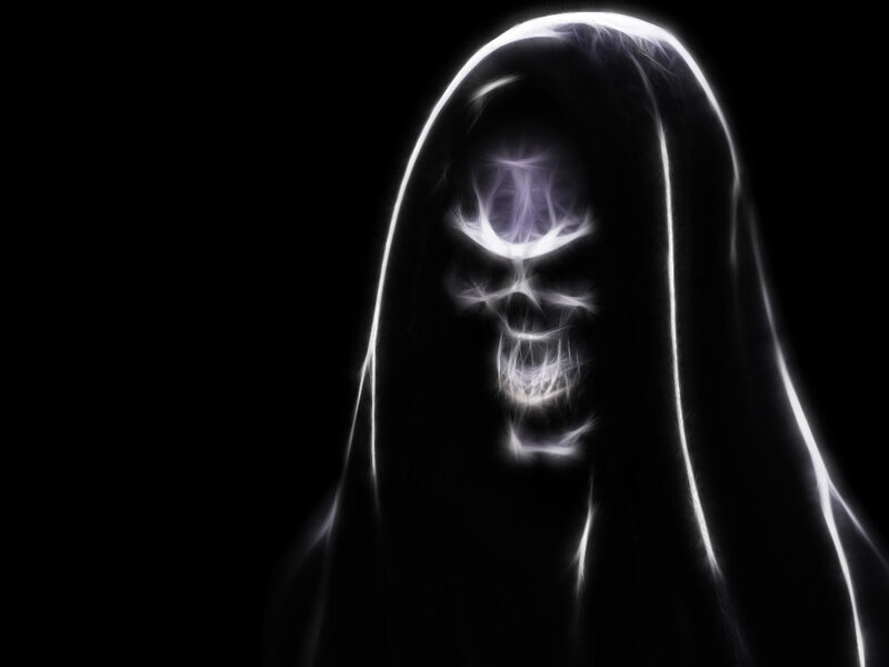 glowing skull in a hood