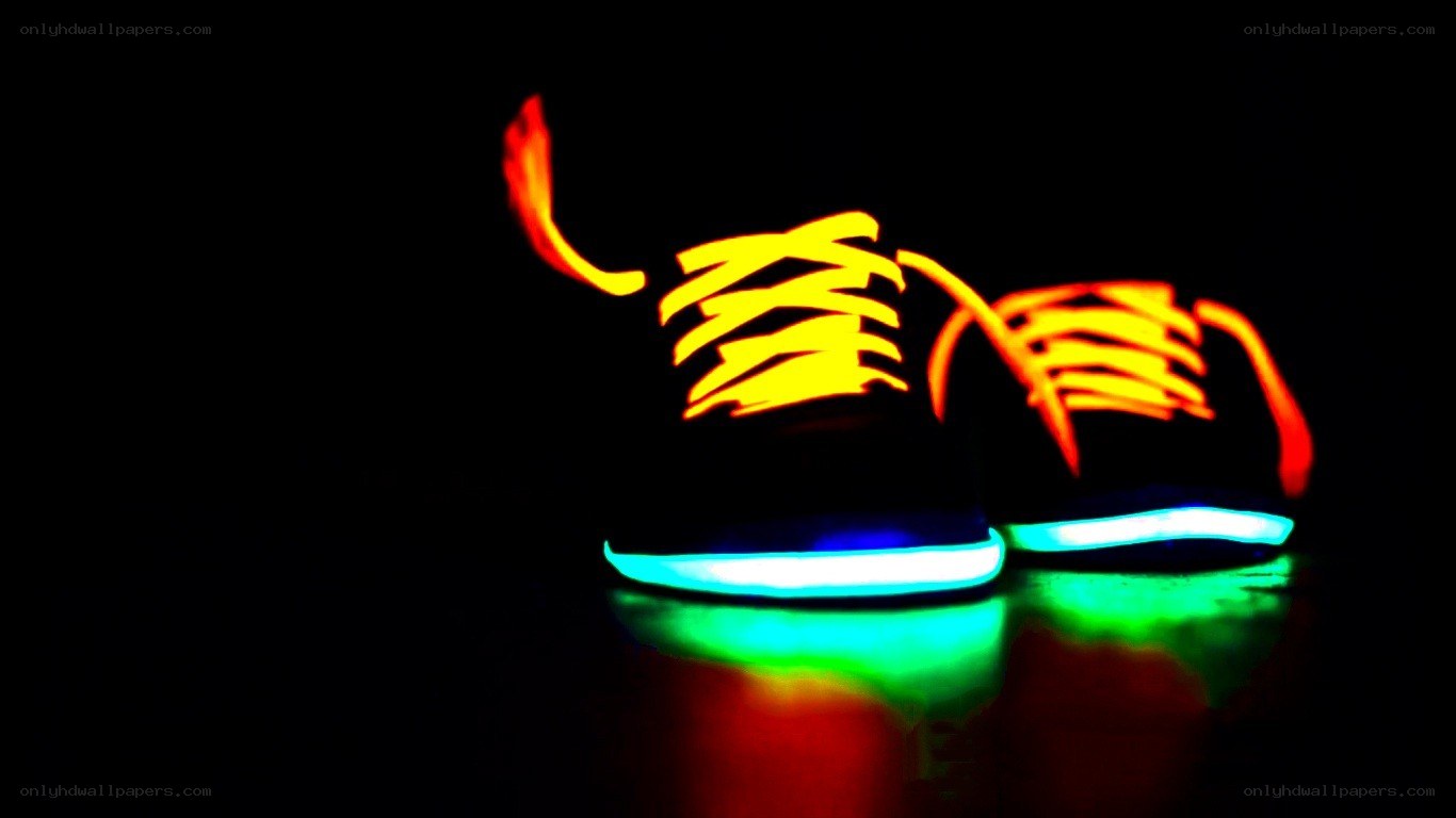 glowing sneakers in darkness
