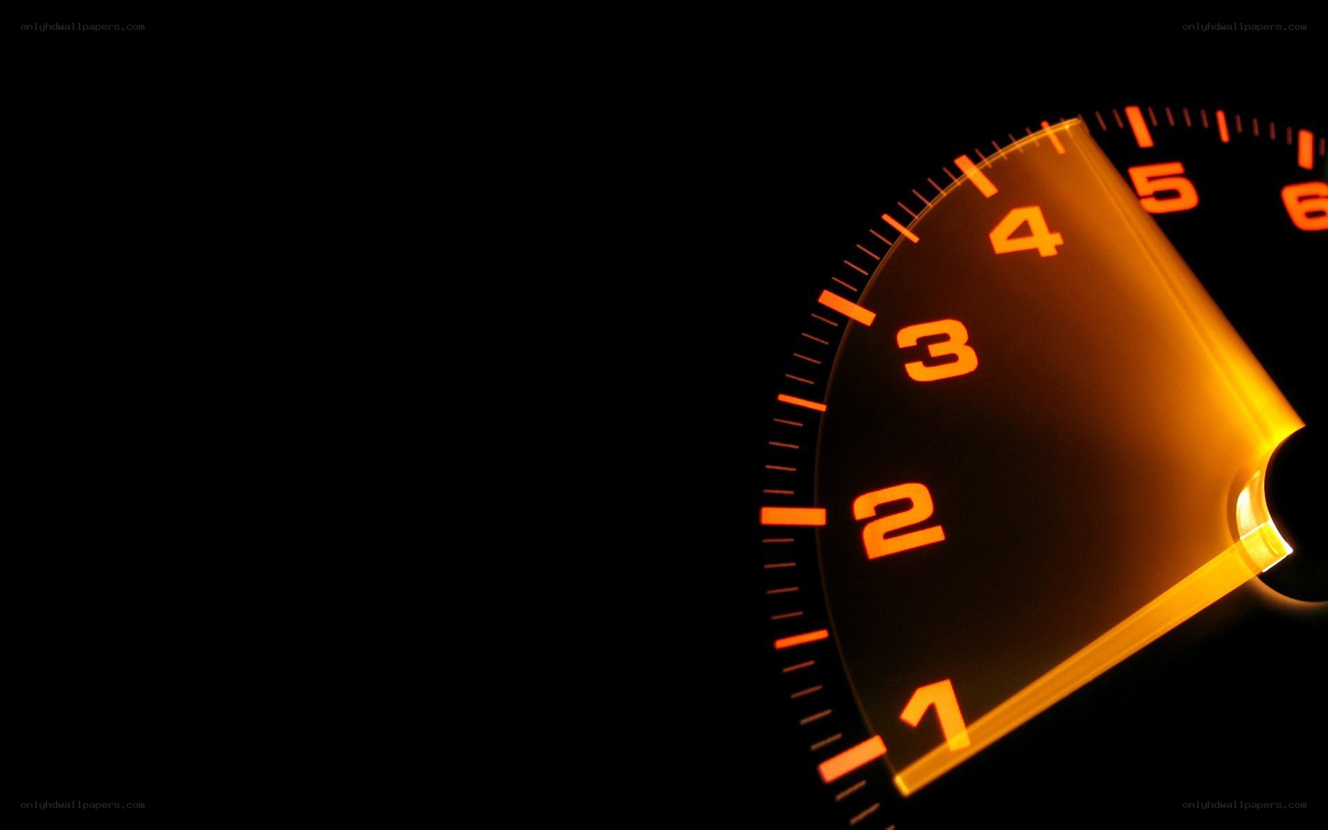 glowing speedometer in darkness