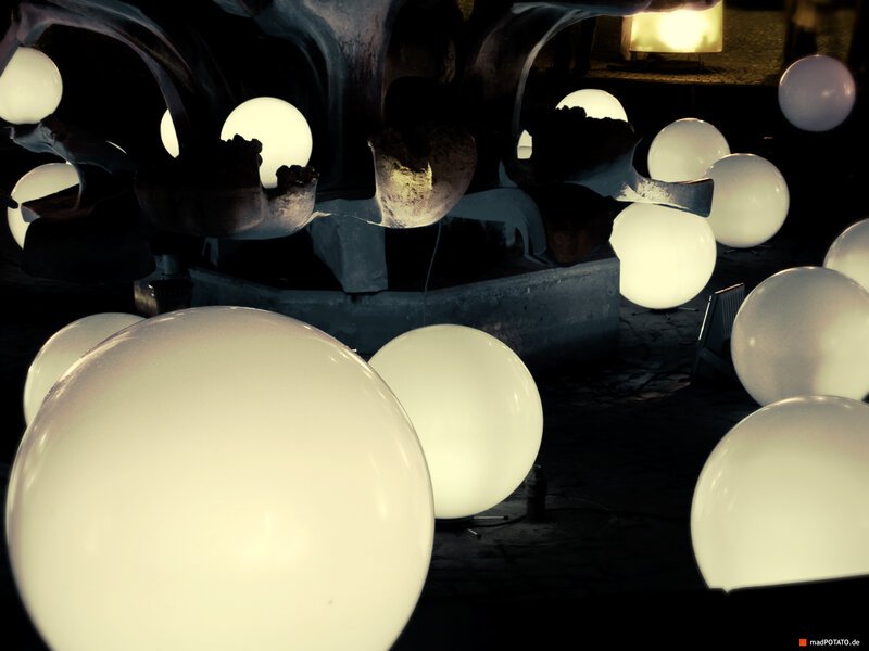 Glowing spheres in dark setting